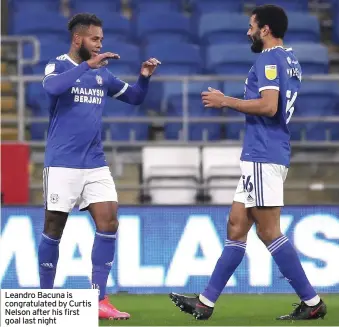  ??  ?? Leandro Bacuna is congratula­ted by Curtis Nelson after his first goal last night