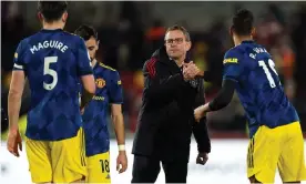  ?? Photograph: Mike Egerton/PA ?? Ralf Rangnick clasps hands with Raphaël Varane after Manchester United’s win at Brentford.