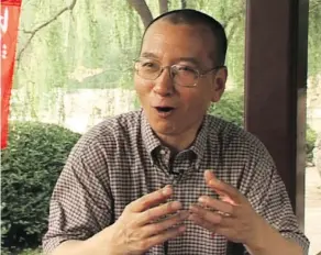  ?? THE ASSOCIATED PRESS ?? In this image taken from July 24, 2008, video footage by AP Video, Liu Xiaobo speaks during an interview at a park in Beijing, China. The judicial bureau in the Chinese city of Shenyang says the jailed Nobel Peace Prize laureate has died at age 61.