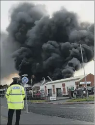  ?? PICTURES: SIMON HULME. ?? Firefighte­rs and other emergency services deal with the massive fire yesterday in Upper Castle Street, Bradford.