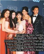  ??  ?? Ken Jeong, Nico Santos, Awkwafina, Michelle Yeoh, Constance Wu, Gemma Chan and Harry Shum Jr pose in the press room holding the Best Comedy trophy for ‘Crazy Rich Asians’.