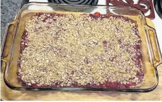  ??  ?? Barbara Nash had just taken these out of the oven when she stopped to snap this photo. I’m not sure that I could have waited that long before sampling. On a day like today, I bet a scoop of ice cream would be perfect on these lovely rhubarb squares.