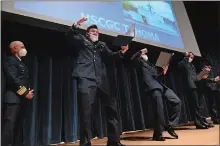  ??  ?? Cadets Jason Bellone, Justin Radcliff, Tyler Dominick and Patrick Moynihan react when they open their billets and discover they will be going to the Coast Guard cutter Tahoma in Kittery, Maine.