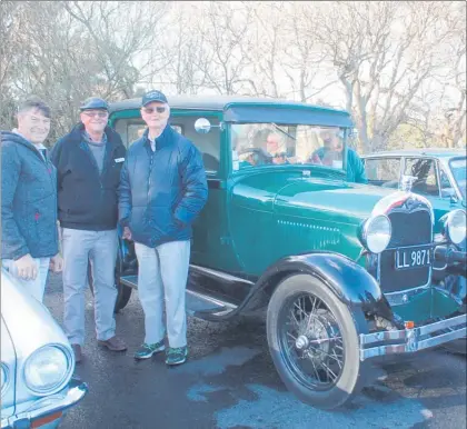  ??  ?? John Clelland with mates Neil Malcolm and Ken Lyons by his 1928 Model A Ford. 1