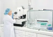  ?? BRENT LEWIN/BLOOMBERG ?? An employee uses Thermo Fisher equipment at a lab in Mongolia. The U.S. company is offering scientists in Canada a wide variety of products that could be used for cannabis testing.