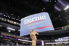  ?? CAROLYN KASTER / AP ?? A supporter for former Democratic presidenti­al candidate and Sen. Bernie Sanders, I-Vt., holds up a sign during the first day of the Democratic National Convention in Philadelph­ia.