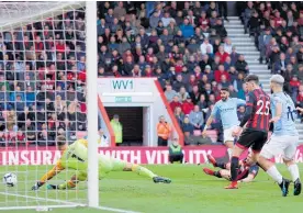  ?? Photo / Getty Images ?? Riyad Mahrez poked in a scruffy goal against Bournemout­h.
