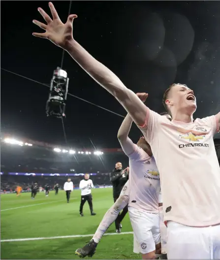  ??  ?? Night to remember: Manchester United’s Scott McTominay celebrates a remarkable victory in the Parc des Princes on Wednesday night. Right: Arthur Albiston back in his Scotland days