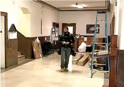  ?? Staff photo ?? Energy efficiency work crews continue improvemen­ts inside the Miller County Courthouse’s Tax Assessor’s Office. Work could be completed by the end of this month or by the start of next month.