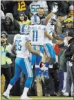  ?? Matt Ludtke ?? The Associated Press Lions running back Ameer Abdullah celebrates his 4-yard touchdown run with teammate Marvin Jones Jr. on Monday.