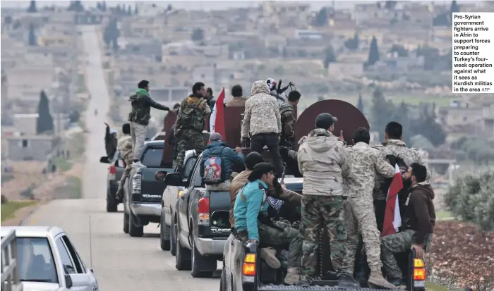 ?? AFP ?? Pro-Syrian government fighters arrive in Afrin to support forces preparing to counter Turkey’s fourweek operation against what it sees as Kurdish militias in the area