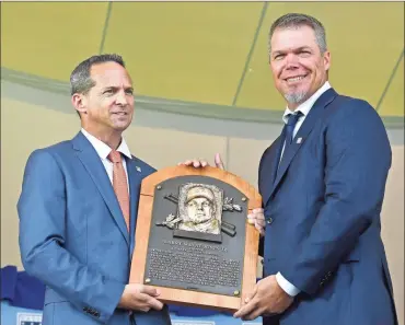  ?? / AP-Hans Pennink ?? Hall of Fame President Jeff Idelson, left, poses with inductee Chipper Jones during a National Baseball Hall of Fame induction ceremony at the Clark Sports Center in Cooperstow­n, N.Y., on Sunday.