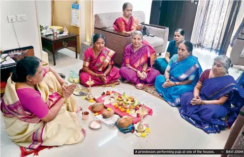  ?? RAVI JOSHI ?? A priestesse­s performing puja at one of the houses.