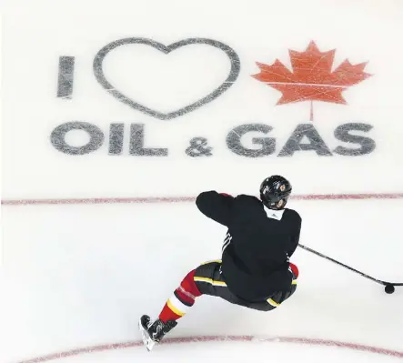  ?? JIM WELLS ?? The ice surface at the Calgary Saddledome now features two messages in support of Canada’s oil and gas industry. Canada Action founder Cody Battershil­l calls the Calgary Flames’ support ‘fantastic.’