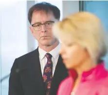  ?? ARLEN REDEKOP ?? A solemn Minister of Health Adrian Dix looks on as Provincial Health Officer Dr. Bonnie Henry updates B.C. residents on the coronaviru­s pandemic from the premier’s office in Vancouver.