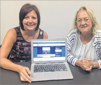  ?? SUBMITTED PHOTO ?? Bonnie Gallant, left, executive director of RDÉE Prince Edward Island, and Gail Lecky, executive director of Canadian Parents for French, check out the new Parents branchés section of the ilebranche­e.ca portal.