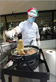  ??  ?? Owner and chef Franco Mari prepares a fried pork loin cutlet.