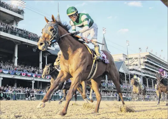  ?? Photos by Skip Dickstein / Times Union ?? Jockey Joel Rosario guides Accelerate to the win in the 35th running of the Breeders’ Cup Classic on Saturday at Churchill Downs in Louisville, Ky.