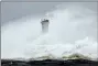  ?? TORU HANAI - THE AP ?? Surging waves hit against the breakwater and a lighthouse as Typhoon Hagibis approaches at a port in town of Kiho, Mie prefecture, central Japan Saturday, Oct. 12.