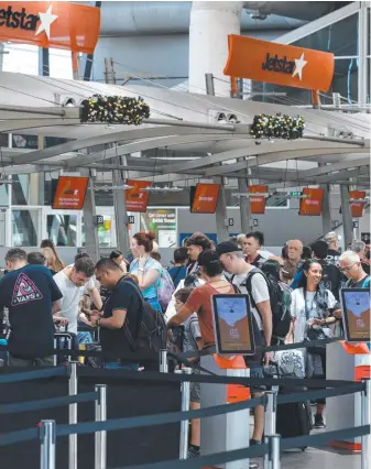  ?? ?? People queue for check in at Sydney Airport as destinatio­ns like the Gold Coast (below) still rate among domestic travellers’ favourite locations. Flight Centre chief executive Graham Turner (right) says the 15 per cent bounce in internatio­nal bookings is dwarfing the local 2 per cent lift.