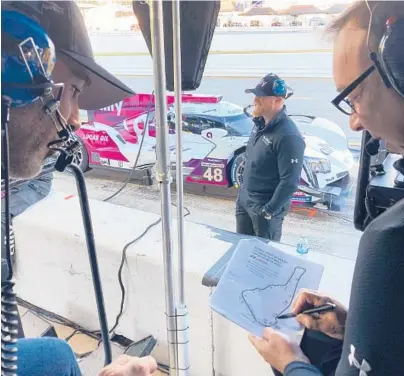  ?? JENNA FRYER/AP ?? Jimmie Johnson, left, listens to crew chief Chad Knaus on Friday at Road Atlanta Raceway in Braselton, Georgia.