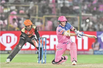  ??  ?? Rajasthan Royals captain Steve Smith (R) plays a shot during the 2019 Indian Premier League (IPL) Twenty20 cricket match between Rajasthan Royals and Sunrisers Hyderabad at the Sawai Mansingh Stadium in Jaipur. - AFP photo