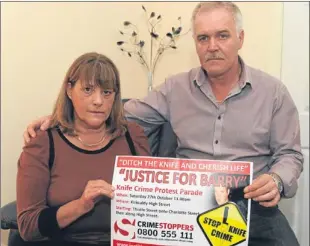  ?? Picture: David Wardle. ?? Barry McLean’s parents, Alan and Tina, with their poster.