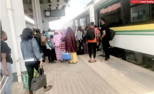  ?? PHOTO: Lami Sadiq ?? Passengers at Idu train station