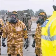  ?? THE ASSOCIATED PRESS ?? Members of the Falcon Squadron, Royal Tank Regiment, at Winterbour­ne Gunner, southern England, conduct final preparatio­n and training before deploying in support of the civil authoritie­s in downtown Salisbury on Friday. British police asked the...