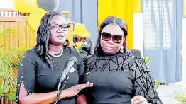  ?? ?? Alcian Samuels-Bennett (left) and her sister, Simone Samuels-Miller, paying tribute to their mother and brother, Angella Samuels and O’Neil Allen, at their service of thanksgivi­ng at the Footprints Seventh-day Adventist Church in Westmorela­nd on Sunday.