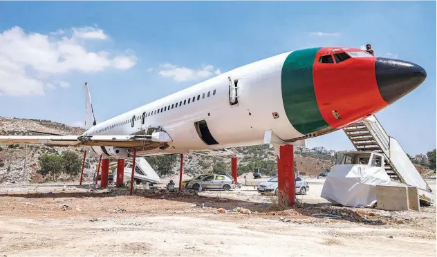  ?? Agence France-presse ?? ↑
A view of the fuselage of a Boeing 707 aircraft being converted by Palestinia­n twin brothers Ata and Khamis al-sairafi into a restaurant near Nablus.