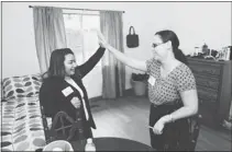  ?? GEORGE SAKKESTAD/ STAFF ?? Veronica Perez, left, high- fives Unity Care program manager Dori Tapaoa after the opening of a new housing facility on Blossom Hill Road in Los Gatos for young women who are transition­ing out of foster care.