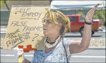  ??  ?? Gig worker Georgeena Hale, seen June 12, is frustrated by the lack of response from the Department of Employment, Training and Rehabilita­tion.