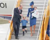  ??  ?? Prince William and family arrive at the Victoria Internatio­nal Airport on Saturday.