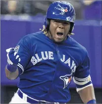  ?? CP PHOTO ?? Toronto Blue Jays’ Vladimir Guerrero Jr. celebrates his walk-off home run to defeat the St. Louis Cardinals 1-0 in the ninth inning of a spring training baseball game Tuesday, March 27, in Montreal.