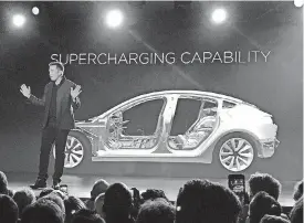  ??  ?? Tesla Motors Inc. CEO Elon Musk speaks at the 2016 unveiling of the Model 3. Musk said Monday on Twitter that the car is ready to start production later this week.