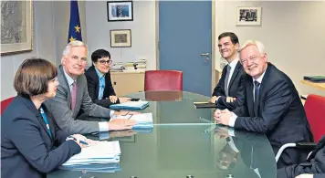  ??  ?? David Davis, the Brexit Secretary, right, at the negotiatin­g table with the EU’S Michel Barnier, and their respective teams