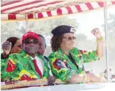  ?? — AFP ?? This file photo taken on June 2, 2017 shows Zimbabwe President Robert Mugabe with his wife Grace Mugabe at Rudhaka Stadium in Marondera.