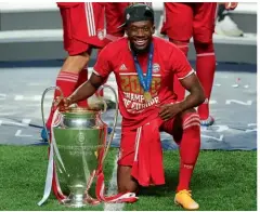  ??  ?? Winner…Davies poses with the Champions League trophy after victory v PSG in August
