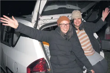  ?? Picture: PAUL CARRACHER ?? NIGHT OUT: Louise Barnett, left, and Andrea Coxon enjoy the Art is... festival drive-in music concert at Horsham Showground.