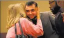  ?? Michael Quine ?? Las Vegas Review-journal Joshua Honea receives an embrace from a family friend after his hearing to request a new trial Wednesday at the Regional Justice Center.