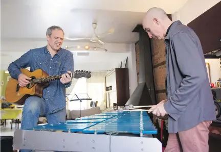  ?? JOHN KENNEY ?? Rob Lutes, left, with Michael Emenau of the band Sussex: “I would come at a song and be playing it, and Michael would say, ‘It breaks every harmonic and compositio­nal rule — but it works.’ ” You can hear Sussex perform Up On The Wall in a video by John Kenney at montrealga­zette.com