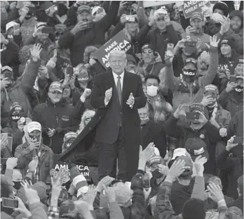  ?? CARLOS OSORIO/AP ?? President Trump arrives at a campaign rally Saturday in Norton Shores, Michigan, a state that may be slipping from him.