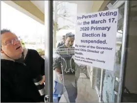  ?? AP PHOTO/GENE J. PUSKAR ?? Jefferson County Elections officials arrive to pack up the polling place at Our Lady of Lourdes church in Wintersvil­le, Ohio, on Tuesday.