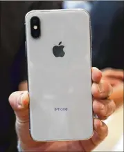  ?? JIM WILSON / NEW YORK TIMES ?? The back of an iPhone X is shown after the event Tuesday. Apple’s new pricing strategy runs contrary to decades in which high-tech device prices have fallen over time, often dramatical­ly, even as the gadgets themselves ran faster and acquired new powers.