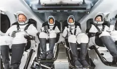  ?? AP ?? From left: Chris Sembroski, Sian Proctor, Jared Isaacman and Hayley Arceneaux sit in the Dragon capsule at Cape Canaveral in Florida.