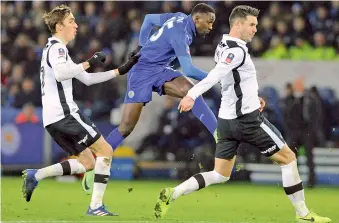  ?? — AP ?? Leicester’s Wilfred Ndidi (centre) scores in their FA Cup fourth round replay match against Derby County at the King Power Stadium on Wednesday. Leicester won 3-1.