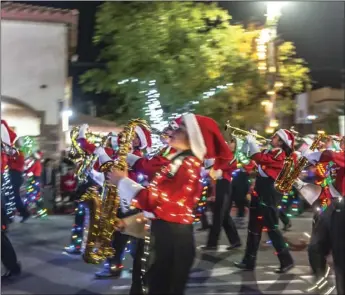  ??  ?? The Frank Wright Middle School marching band performs during the 16th annual Parade of Lights held Friday night in Imperial. PHOTO VINCENT OSUNA