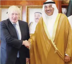  ?? — AFP ?? KUWAIT: Kuwaiti Foreign Minister Sheikh Sabah Al-Khaled Al-Sabah meets his British counterpar­t Boris Johnson yesterday.