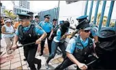  ?? RICARDO ARDUENGO/AP 2009 ?? More than 2,700 Puerto Rico police officers are absent every day as anger over unpaid overtime rises.